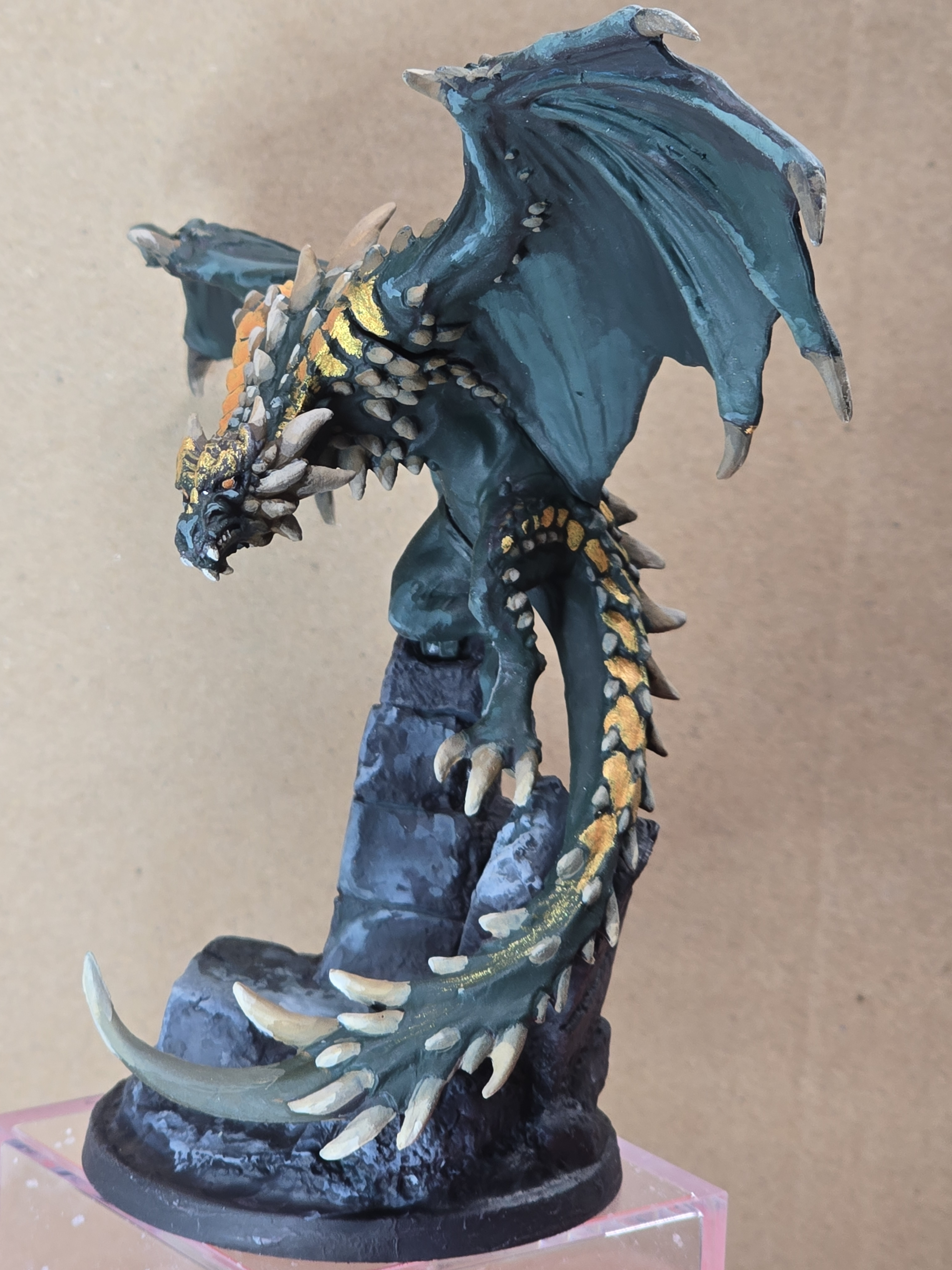 A green and gold wyvern-style dragon